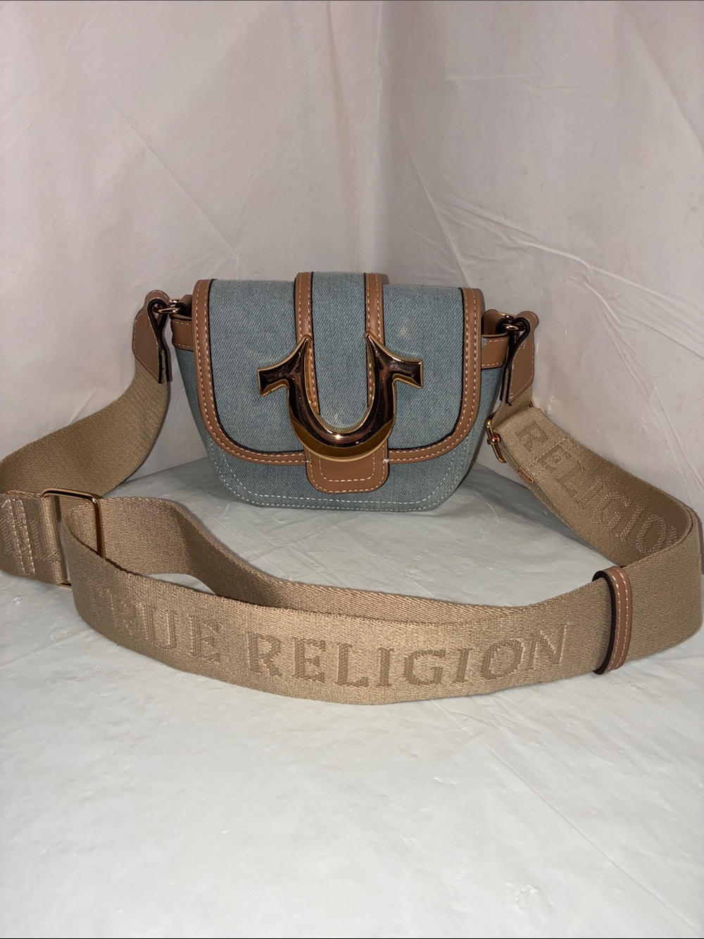 True Religion Light Denim Crossbody with Tan Trim and Gold Logo